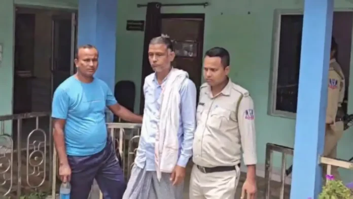 Binnaguri Gram Panchayat Pradhan Samijuddin Ahmed being taken into custody in connection with the 2021 post-poll violence case. Monday, 25 May 2026.