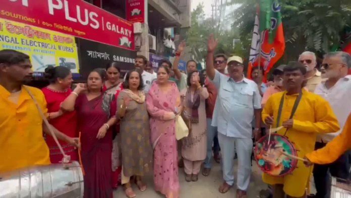 BJP workers and supporters distribute sweets in Siliguri to celebrate the increased representation of North Bengal in the newly formed West Bengal cabinet on Monday. 01 June 2026.